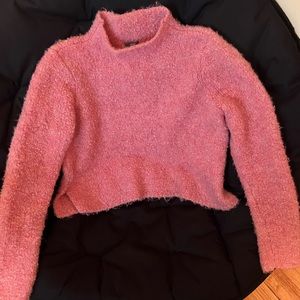 Assorted sweaters ranging from crop to open cardigan